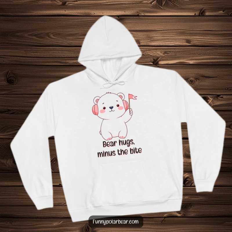 Funny polar bear wearing earmuffs and waving a small flag, featured on a cozy hoodie, embodying warmth and cheerful greetings.