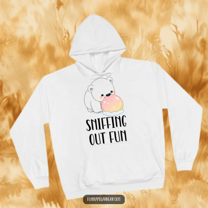 Funny Polar Bear Snowball Hoodie: A curious polar bear humorously sniffs a large, brightly colored snowball, embodying winter exploration.